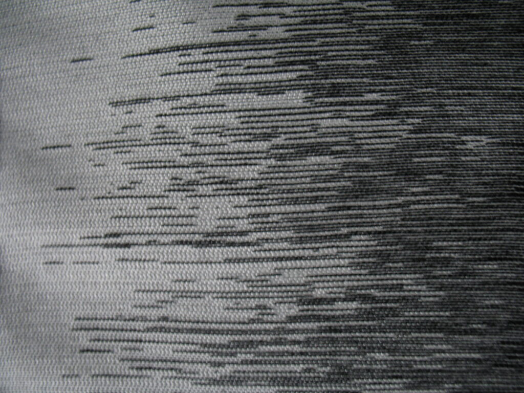 Grey and black patterned upholstery fabric