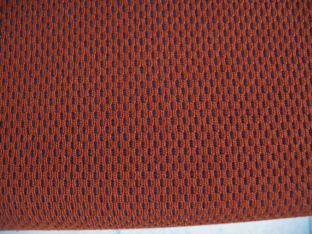 Kvadrat Febrik Plecto 564 rust brown burnt orange blue
