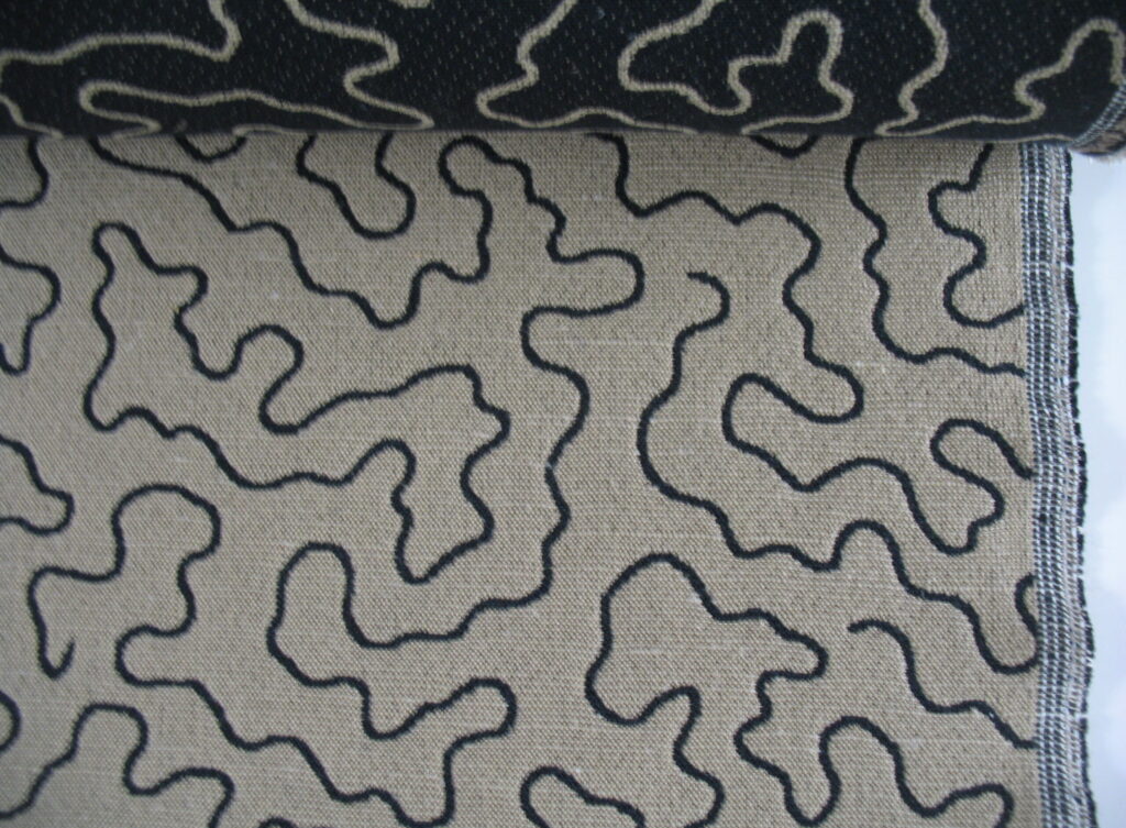 Upholstery fabric black pattern on beige