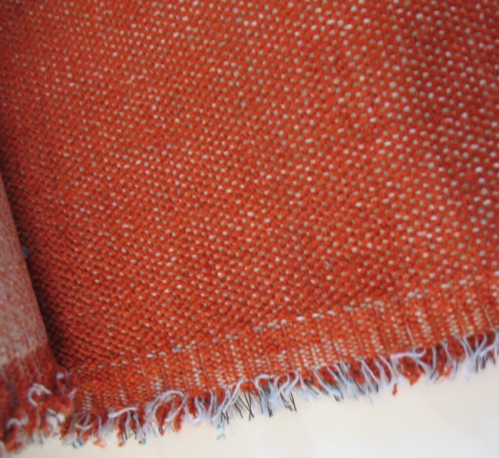 Aristide upholstery fabric: dark orange, cream and grey