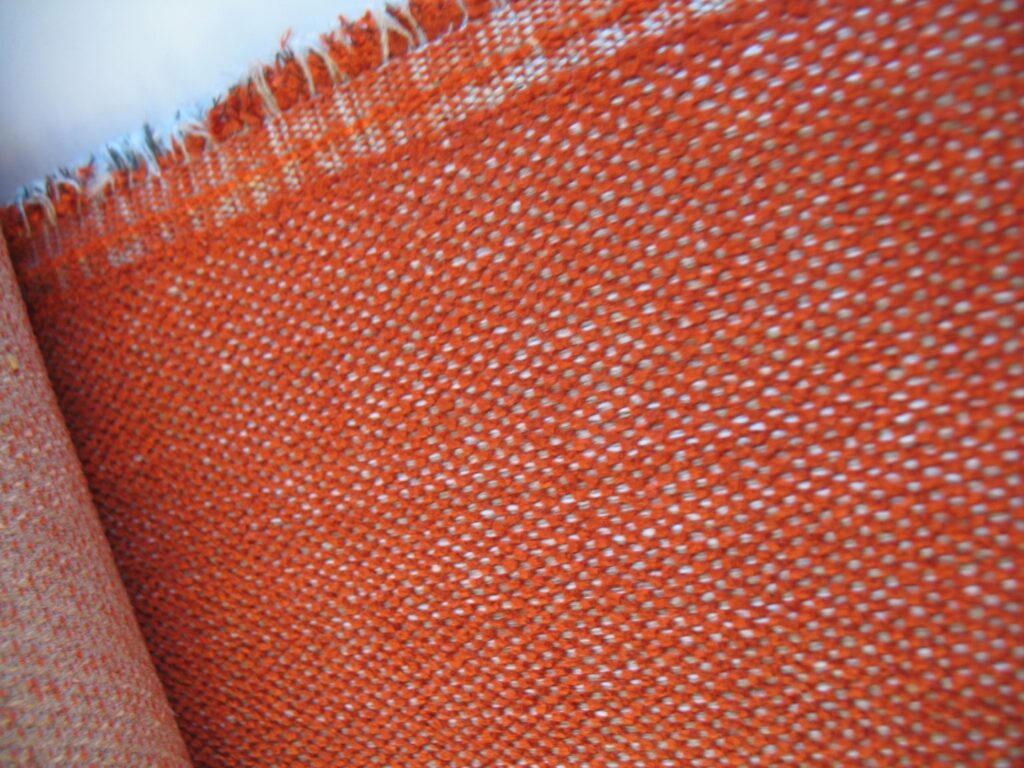 Aristide upholstery fabric: dark orange, cream and grey