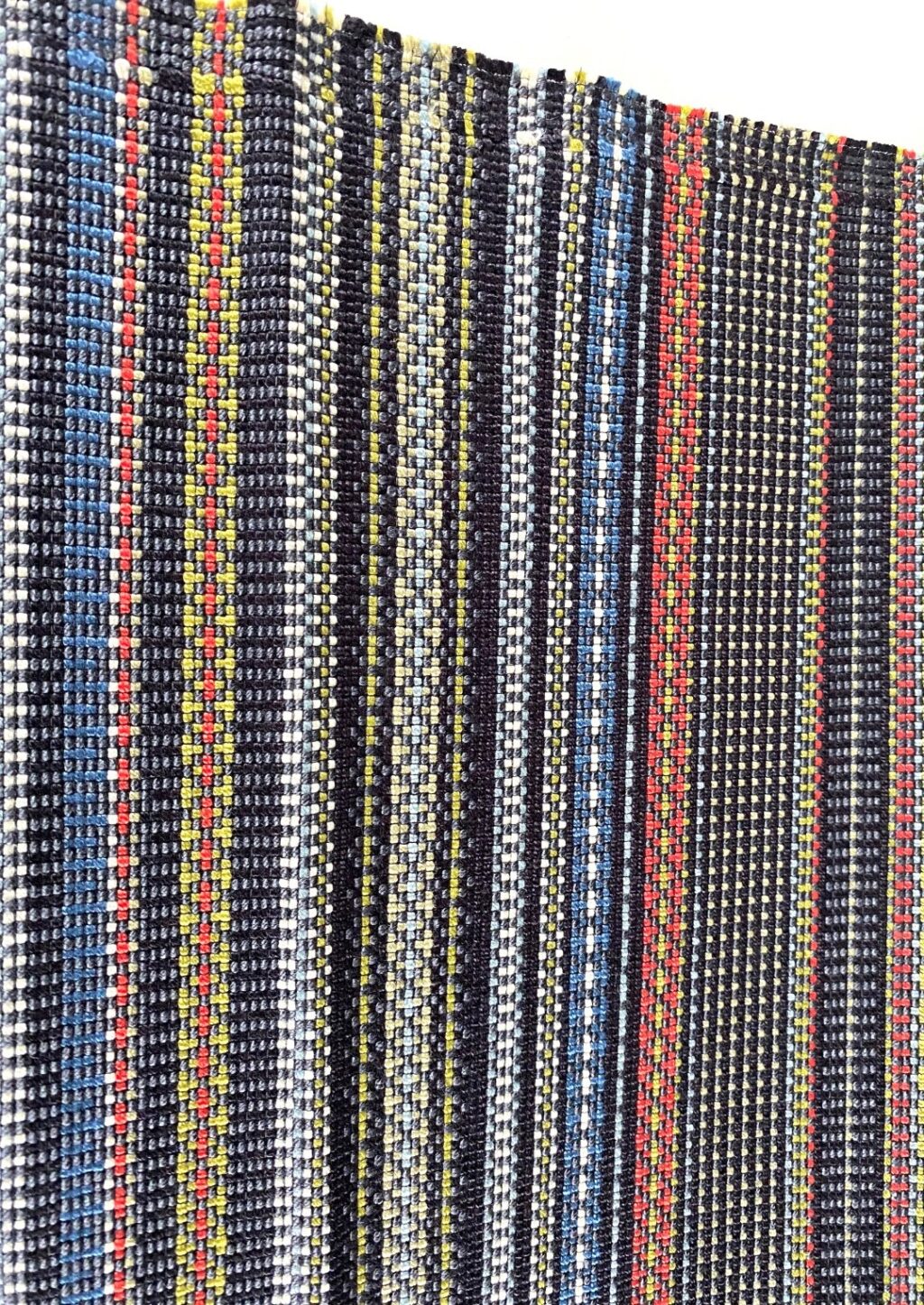 Maharam Point 003 Slate and Khaki – black with coloured accents