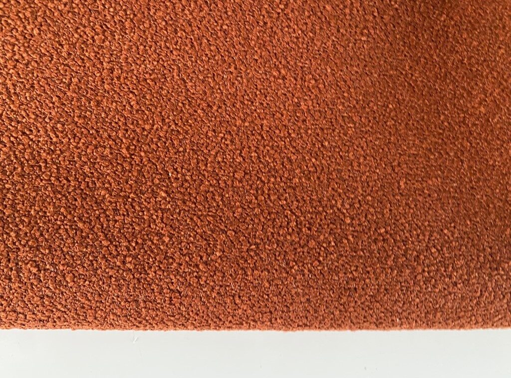 Bouclé upholstery burnt orange brown orange