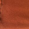 Bouclé upholstery burnt orange brown orange