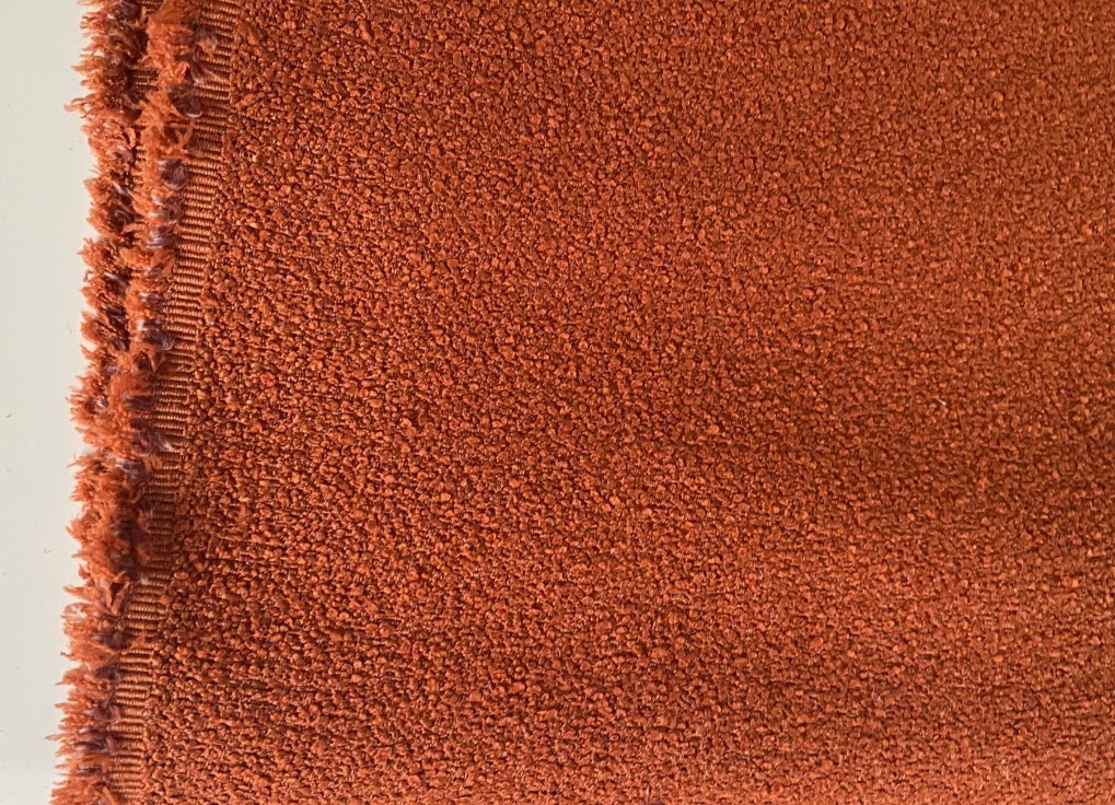 Bouclé upholstery burnt orange brown orange