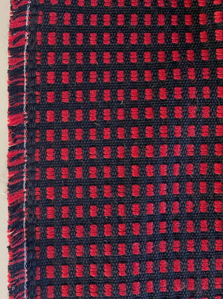 Red and black checkered upholstery fabric