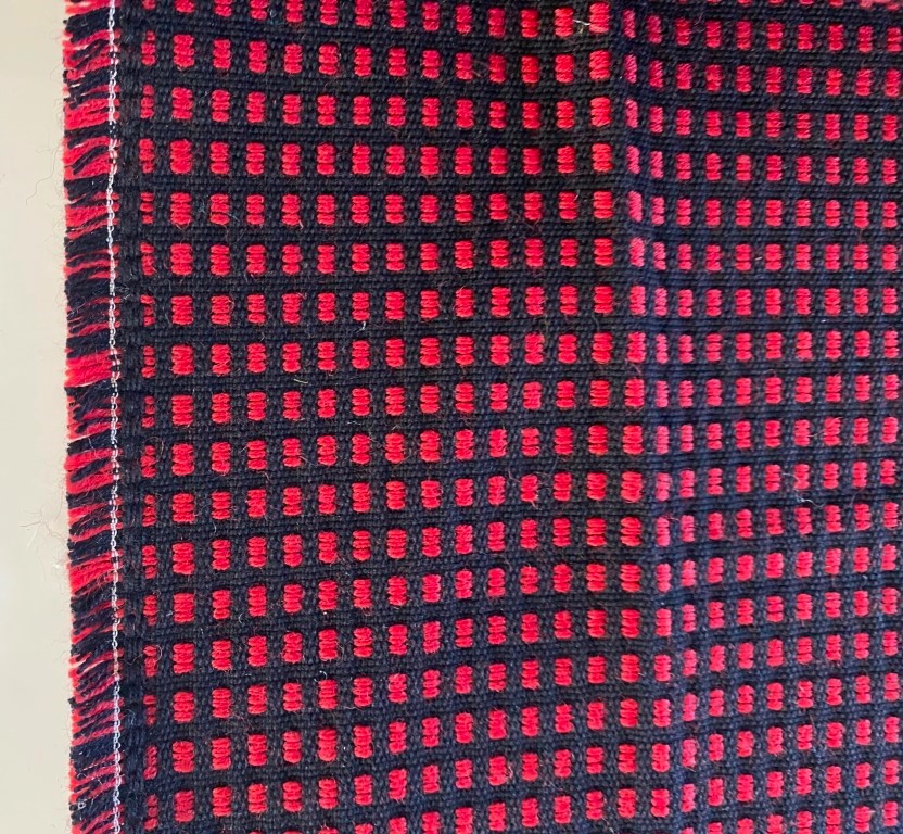 Red and black checkered upholstery fabric