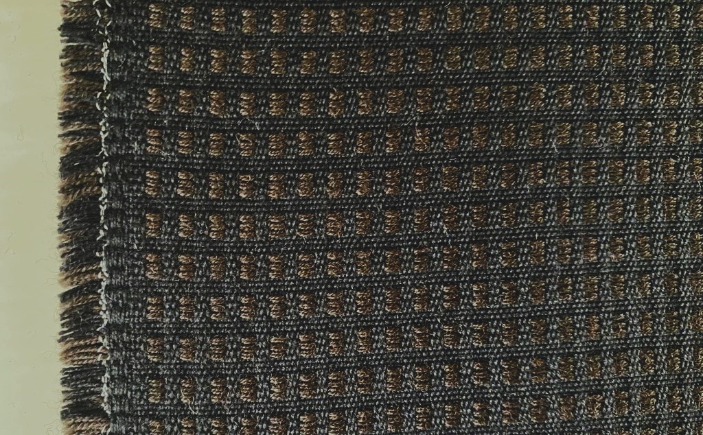 De Ploeg brown and black chequered pattern