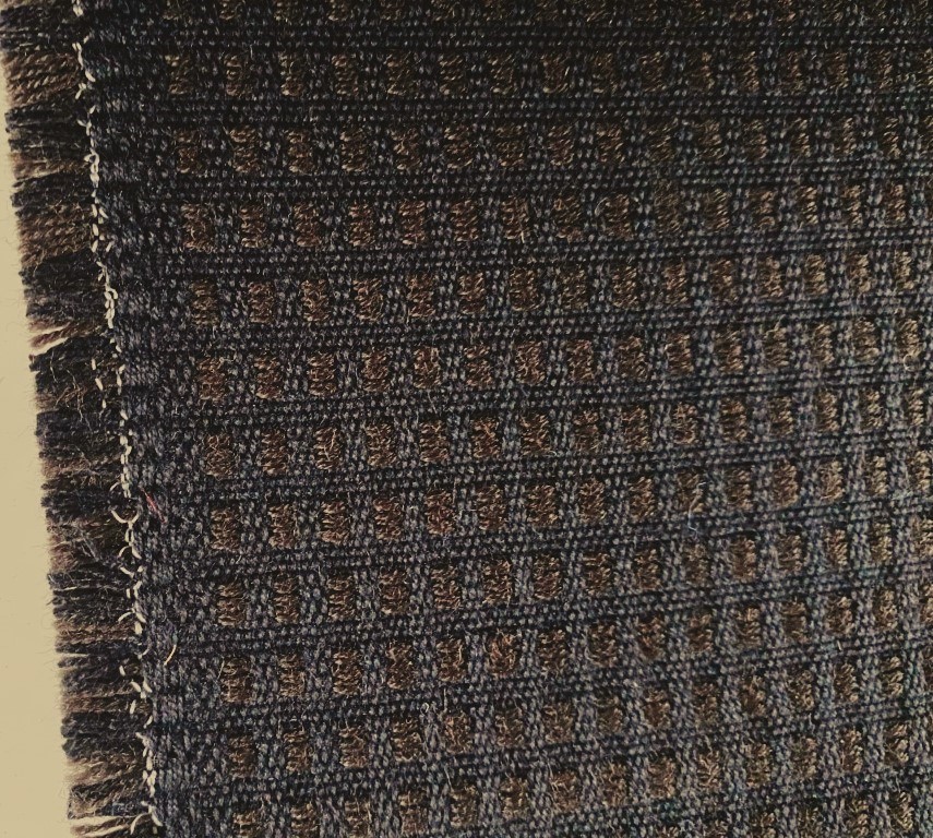 De Ploeg brown and black chequered pattern