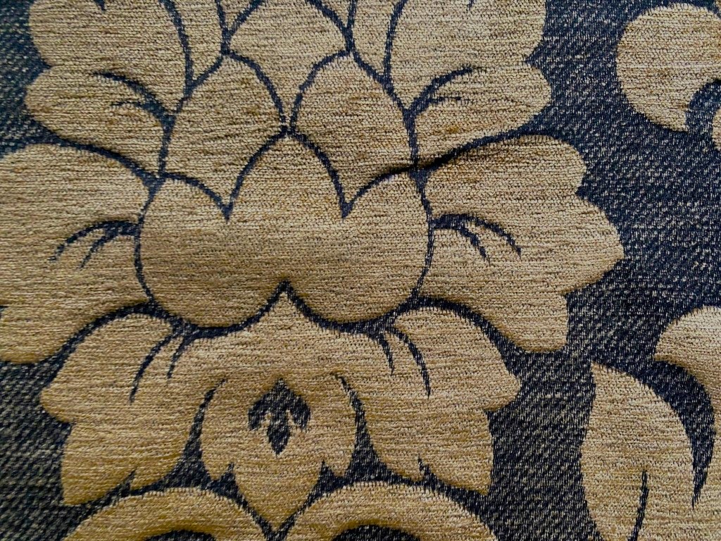 Baroque-patterned furniture fabric in camel on black