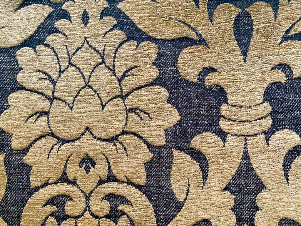 Baroque-patterned furniture fabric in camel on black