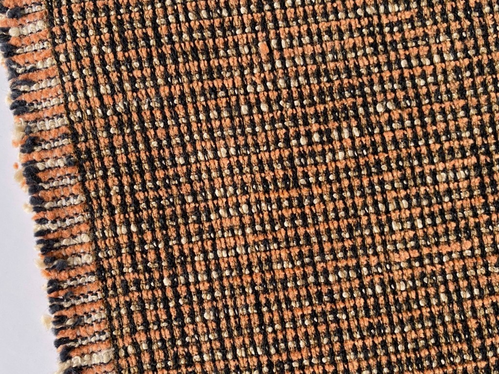 Upholstery fabric pattern orange cream black