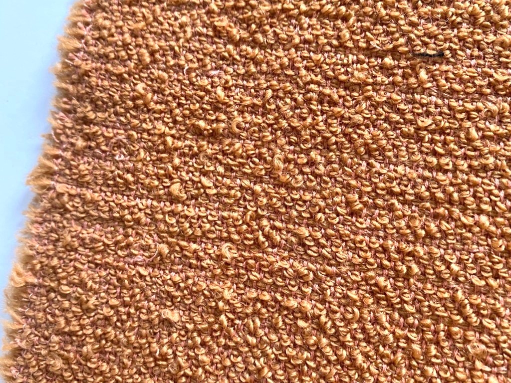 De Ploeg bouclé soft orange salmon pink